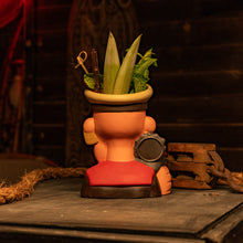 Ceramic Tiki mug in the shape of a sailor, featuring plants as decoration, perfect for tropical cocktails.