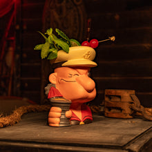 A handcrafted ceramic tiki mug featuring a playful sailor character with a garnish of mint and cherries. Pre-order now!