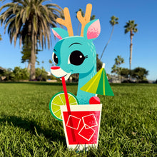 Cheerful reindeer yard stake holding a drink, featuring bright colors and playful design, perfect for holiday decor.