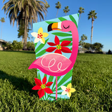 Colorful flamingo yard stake with flowers, designed by Jeff Granito, perfect for festive outdoor decor.