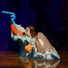 Handcrafted ceramic tiki mug featuring a shark and ship design, ideal for cocktail lovers and collectors. Pre-order now!