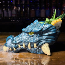 Dragon-shaped drink container with a cocktail inside on a bar counter